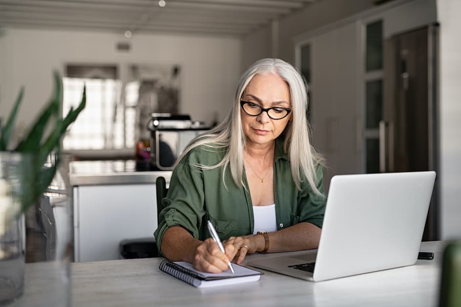 woman leader receiving training at her computer